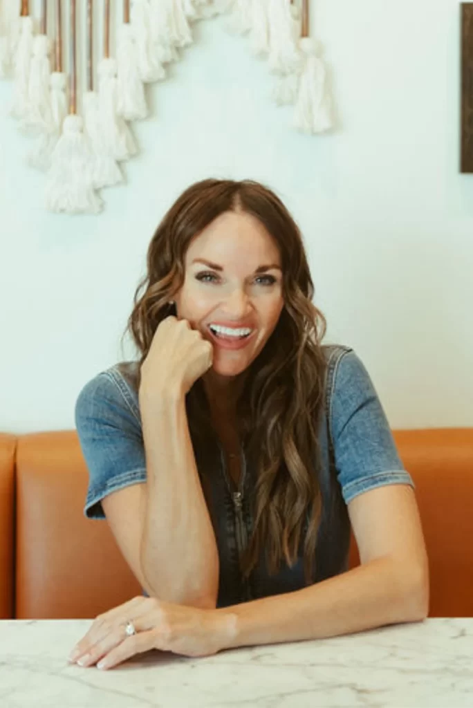 Erica Suzanne Matchmaker sat at a table smiling